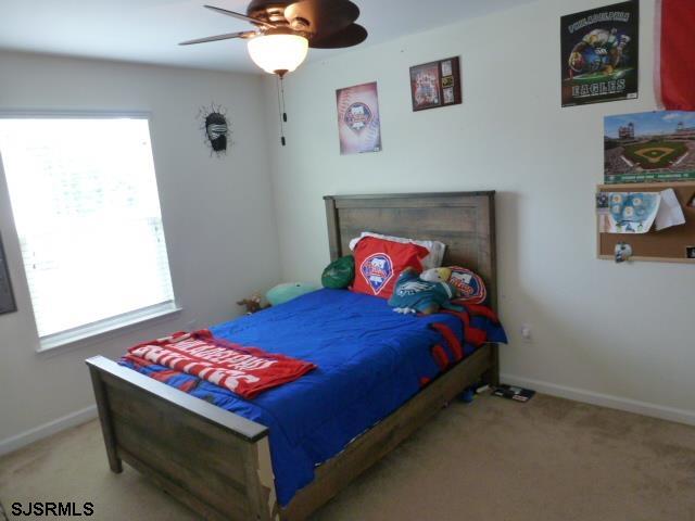 218 Surf Road Egg Harbor Township, NJ 08234 - Photo 18 of 28 a bedroom with a bed and a window