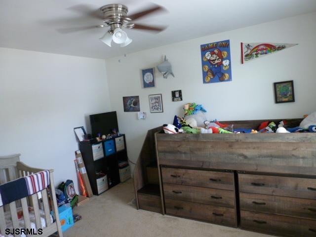 218 Surf Road Egg Harbor Township, NJ 08234 - Photo 19 of 28 a bedroom with a bed and furniture