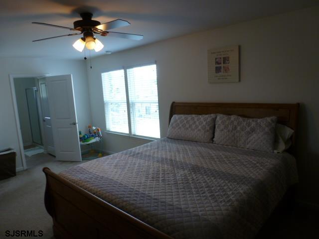 218 Surf Road Egg Harbor Township, NJ 08234 - Photo 21 of 28 a bed sitting in a bedroom next to a window