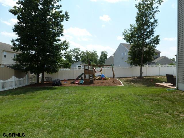 218 Surf Road Egg Harbor Township, NJ 08234 - Photo 26 of 28 a view of a garden with a slide