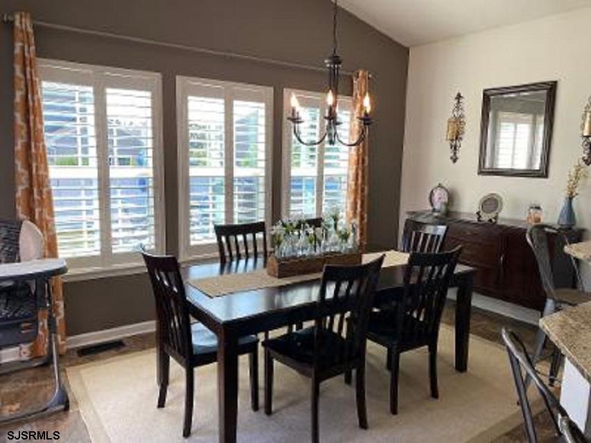 218 Surf Road Egg Harbor Township, NJ 08234 - Photo 5 of 28 a view of a dining room with furniture window and outside view
