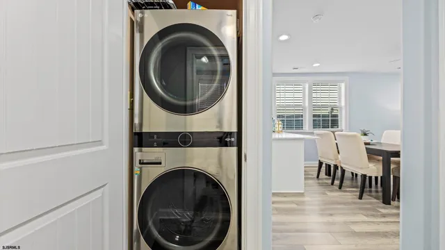 a view of a hallway with washer and dryer