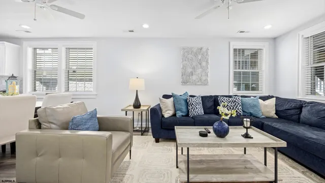 a living room with furniture and windows