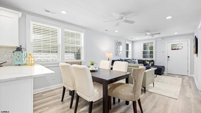 a view of a dining room with furniture and window