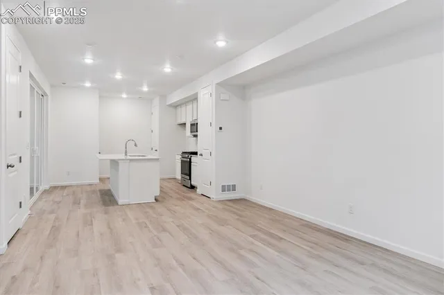 a view of kitchen with wooden floor