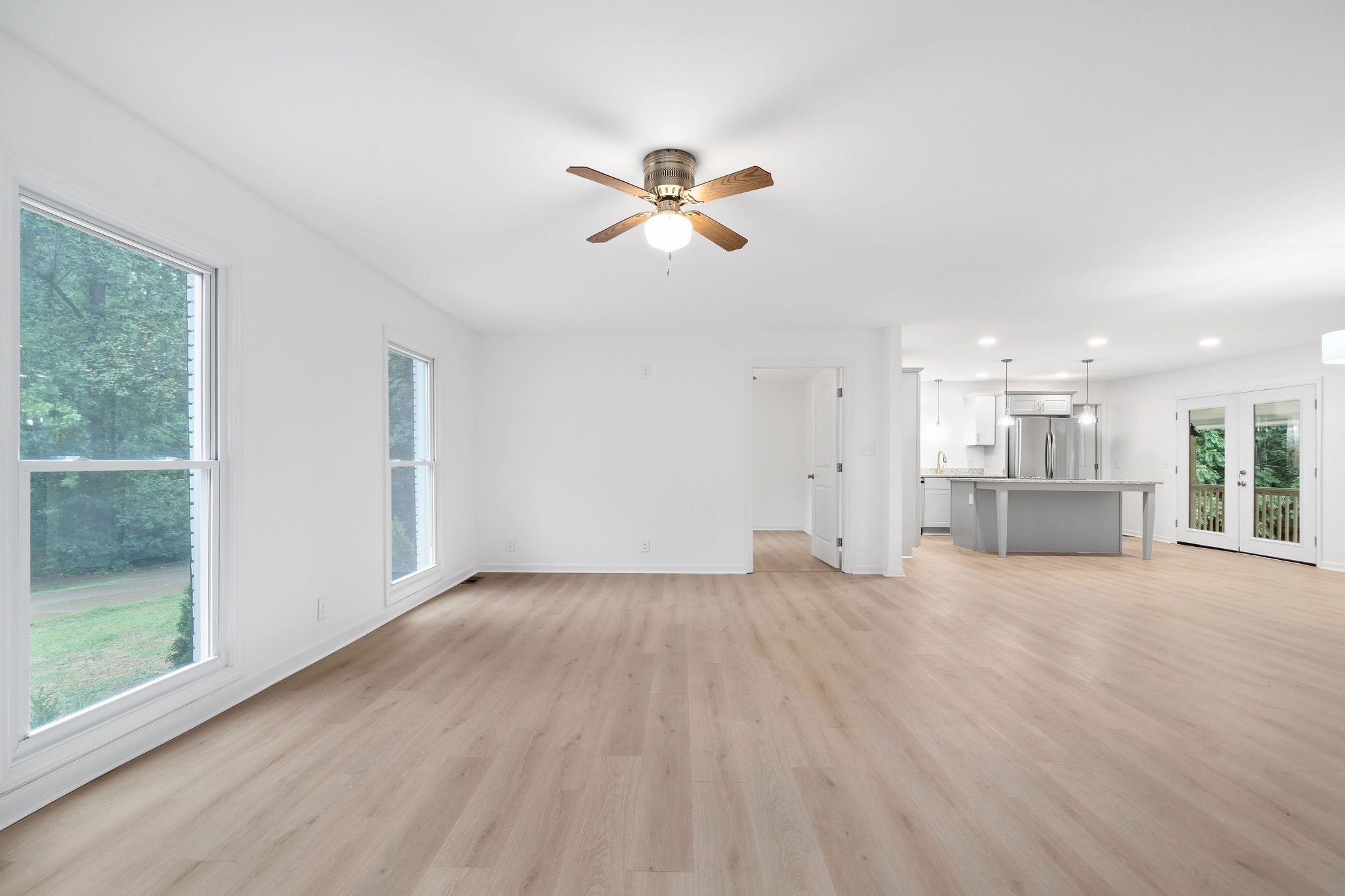 342 Highway 13 Cunningham, TN 37052 - Photo 11 of 44 a view of empty room with wooden floor and fan