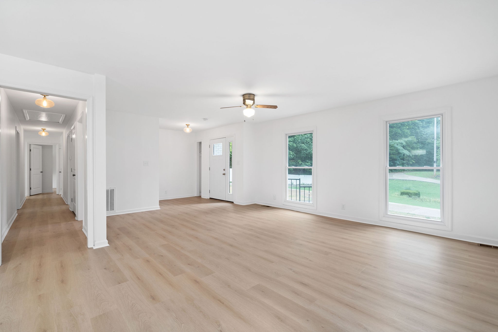 342 Highway 13 Cunningham, TN 37052 - Photo 12 of 44 an empty room with wooden floor and windows