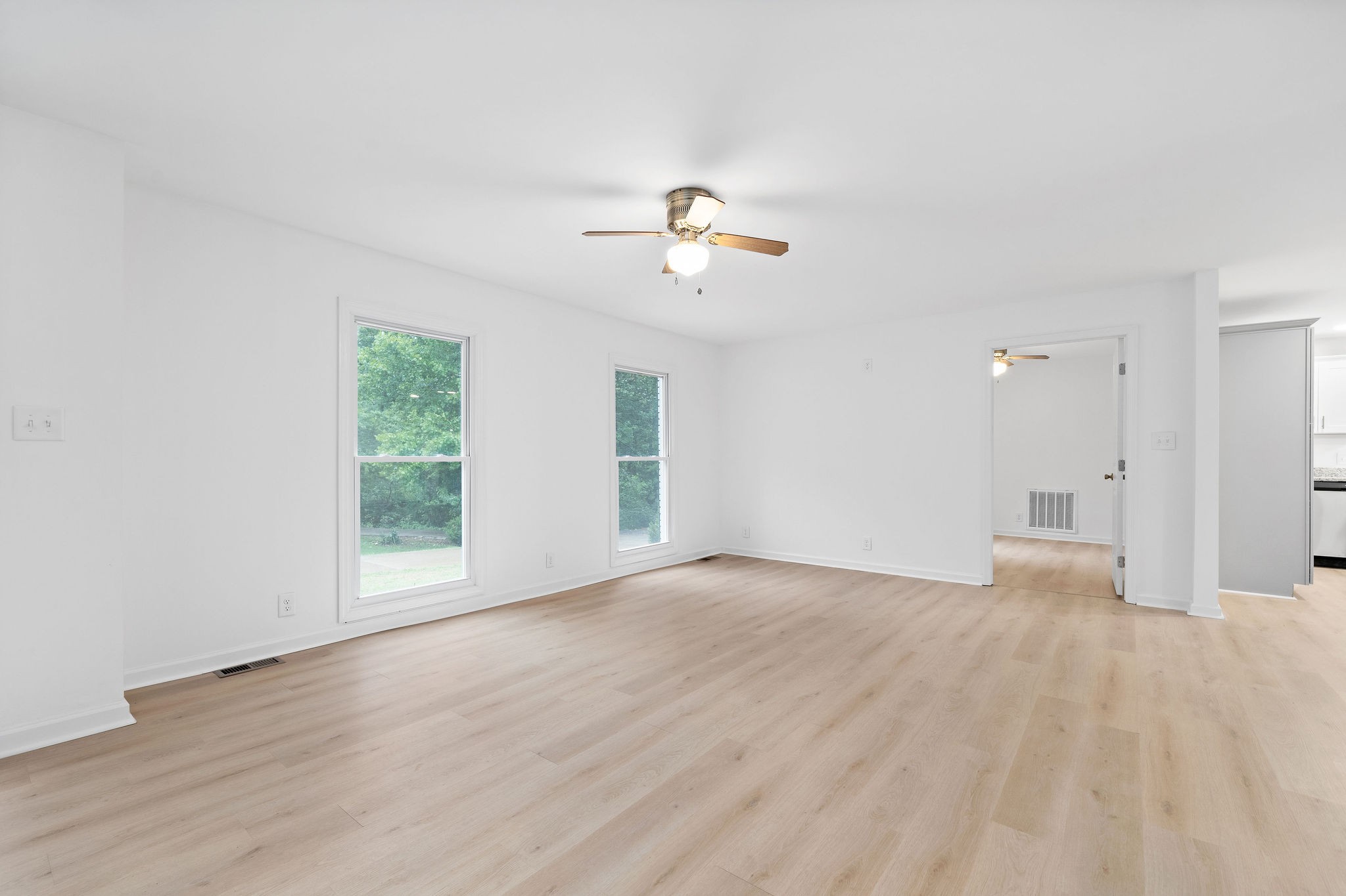 342 Highway 13 Cunningham, TN 37052 - Photo 14 of 44 wooden floor in an empty room with a window