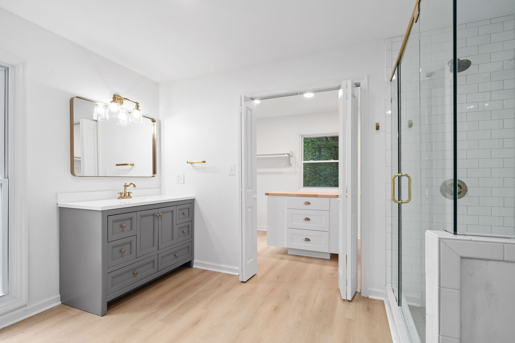 342 Highway 13 Cunningham, TN 37052 - Photo 18 of 44 a bathroom with a double vanity sink a mirror and a bathtub