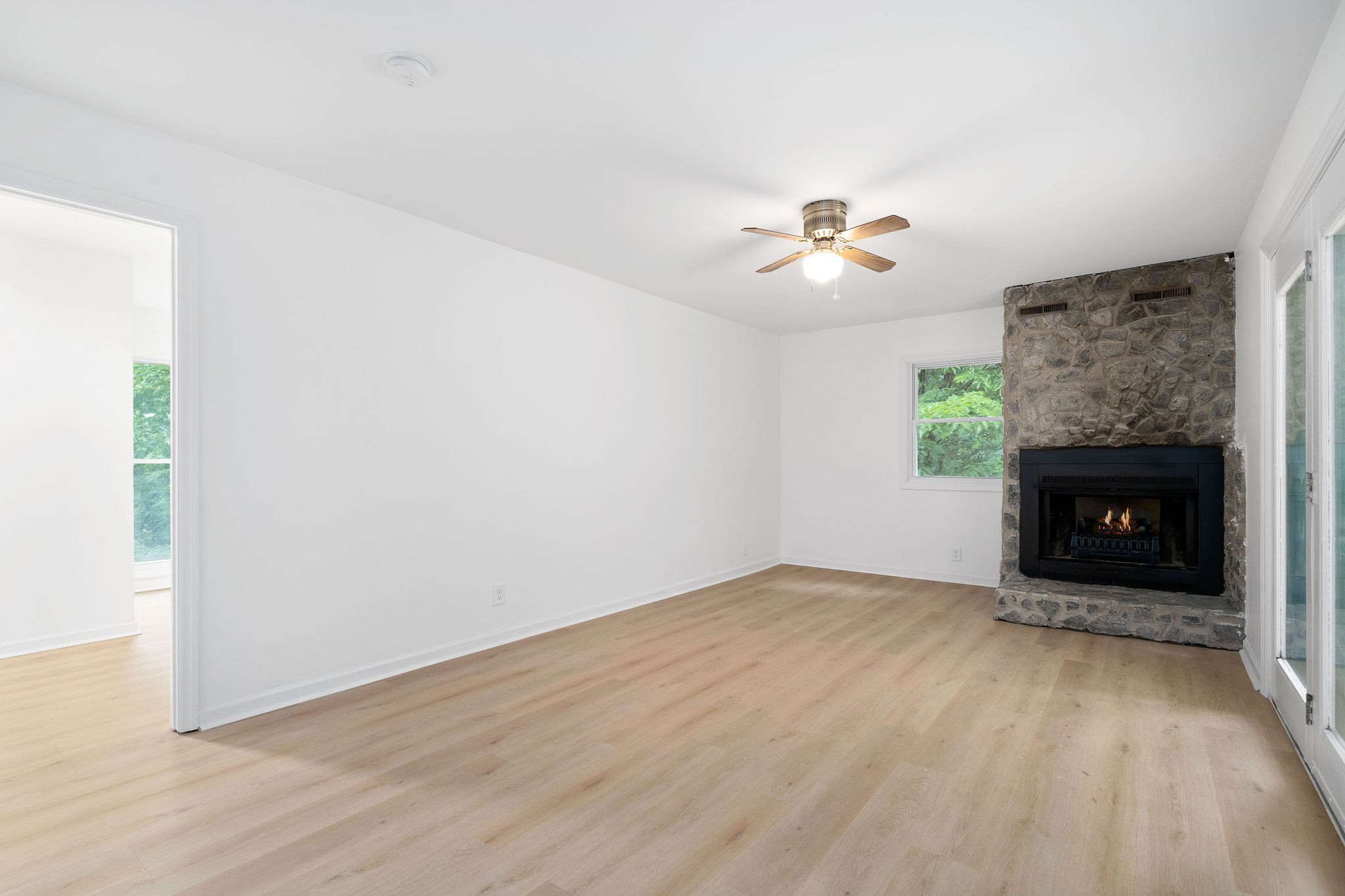 342 Highway 13 Cunningham, TN 37052 - Photo 20 of 44 an empty room with windows and a fireplace