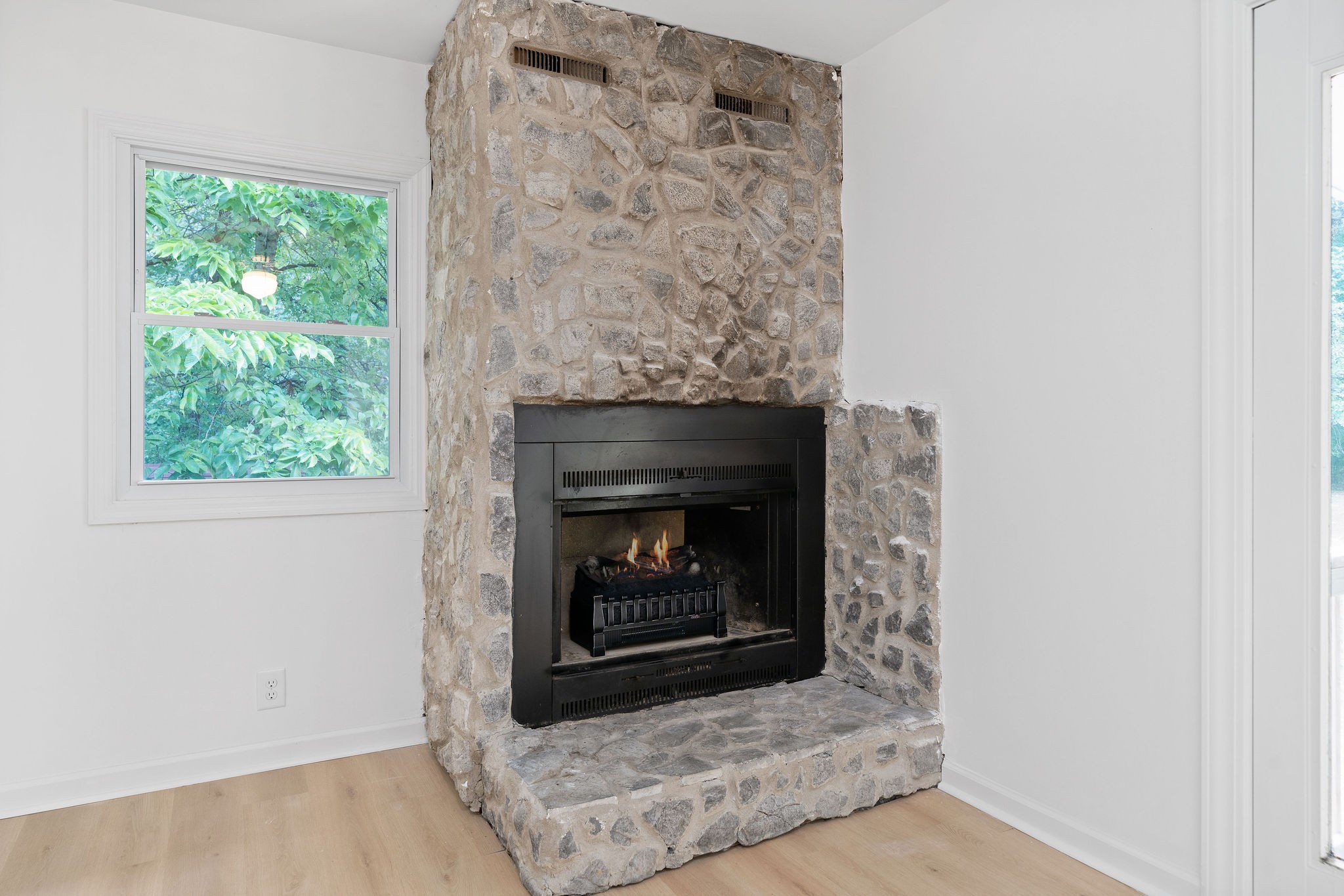 342 Highway 13 Cunningham, TN 37052 - Photo 21 of 44 a living room with a fireplace