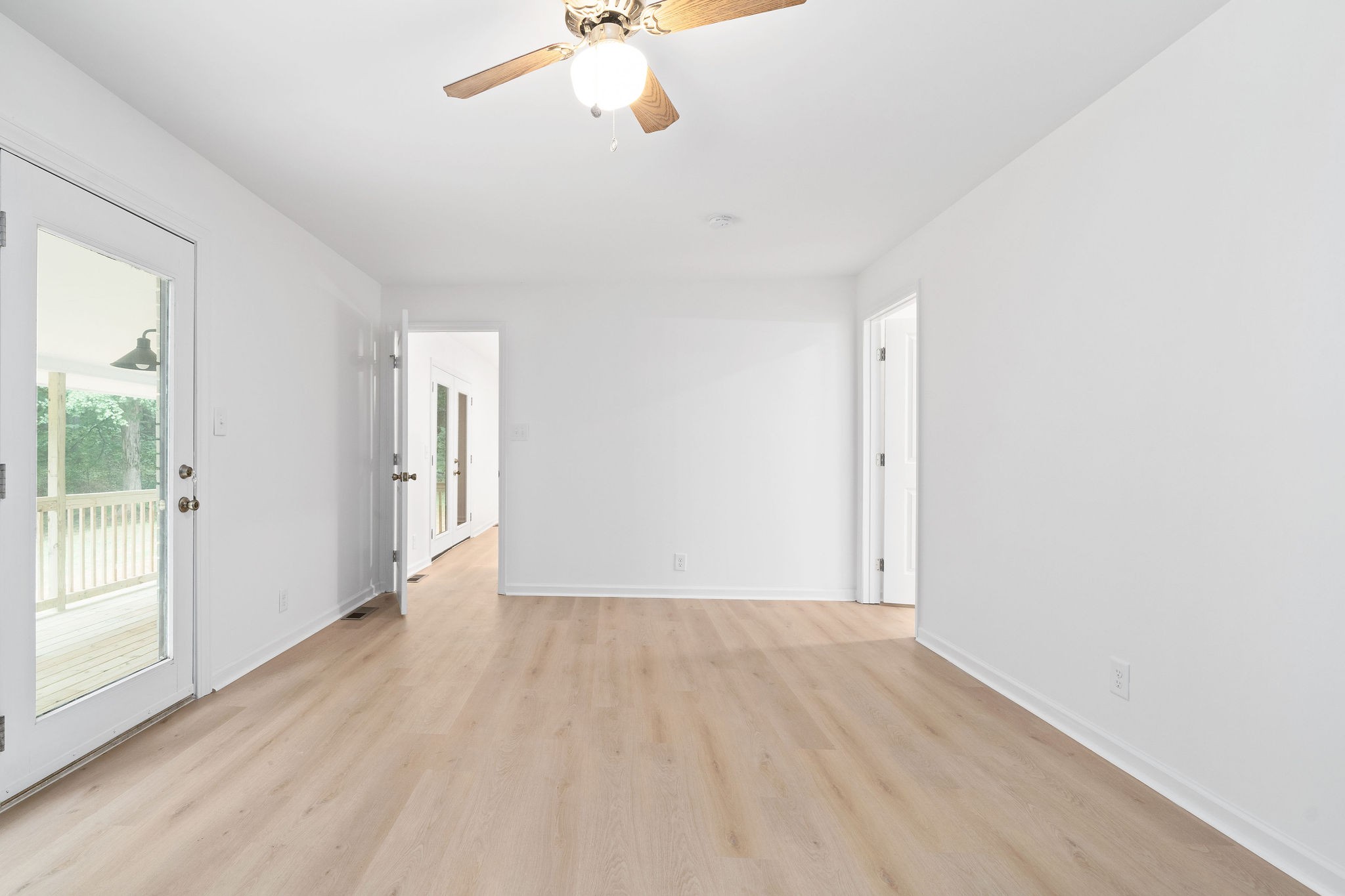 342 Highway 13 Cunningham, TN 37052 - Photo 22 of 44 wooden floor in an empty room with a window