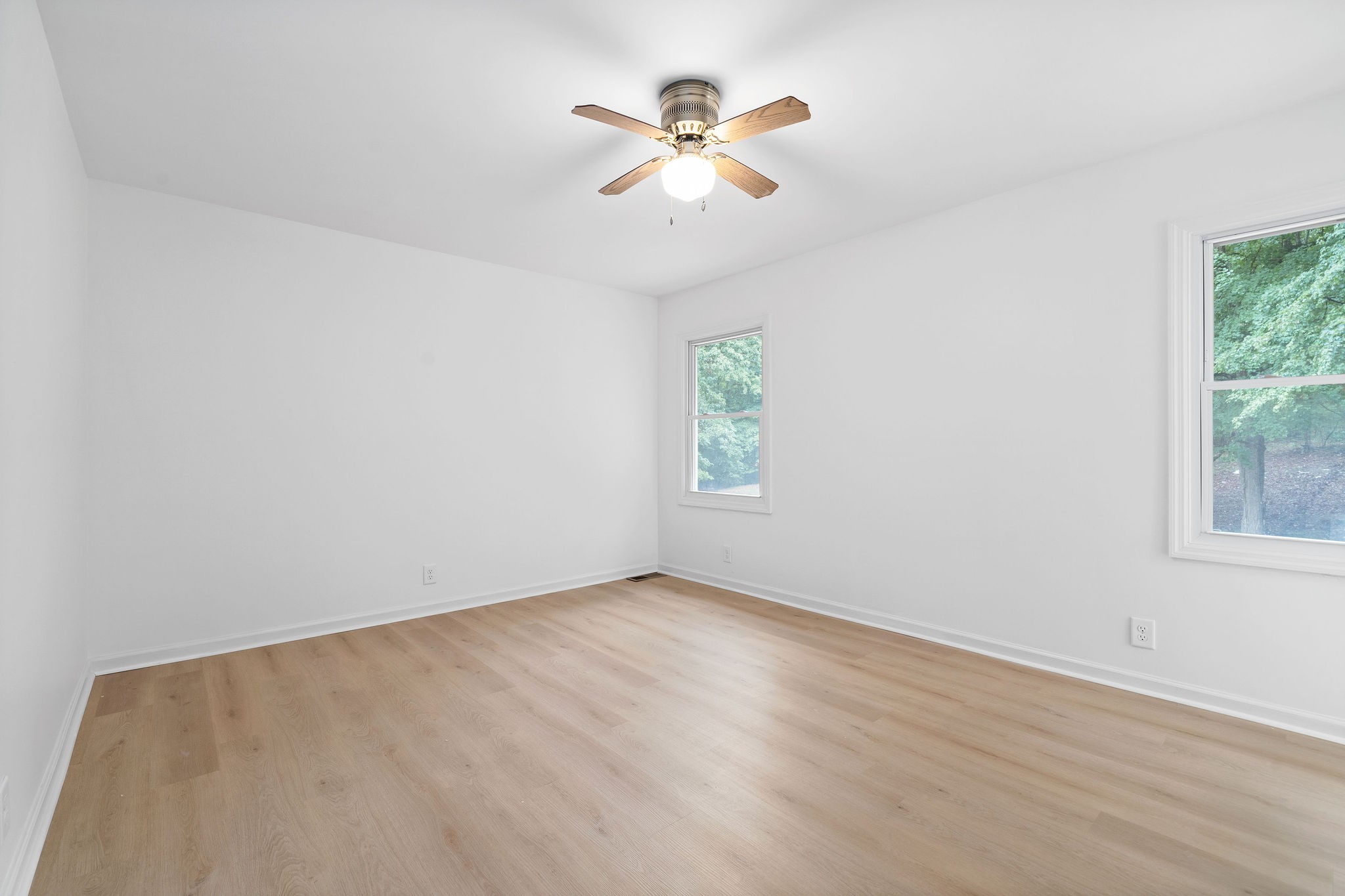 342 Highway 13 Cunningham, TN 37052 - Photo 29 of 44 an empty room with a window and a fan