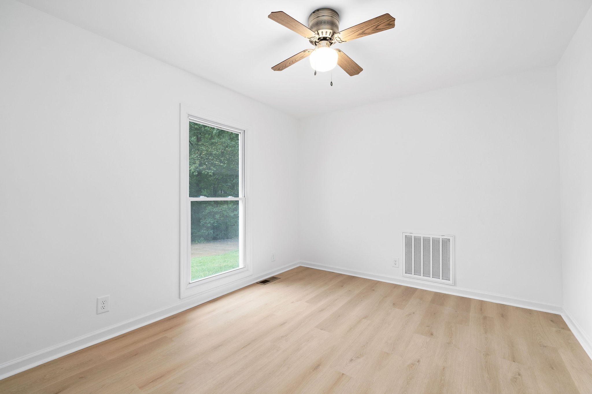342 Highway 13 Cunningham, TN 37052 - Photo 30 of 44 an empty room with a window and a ceiling fan
