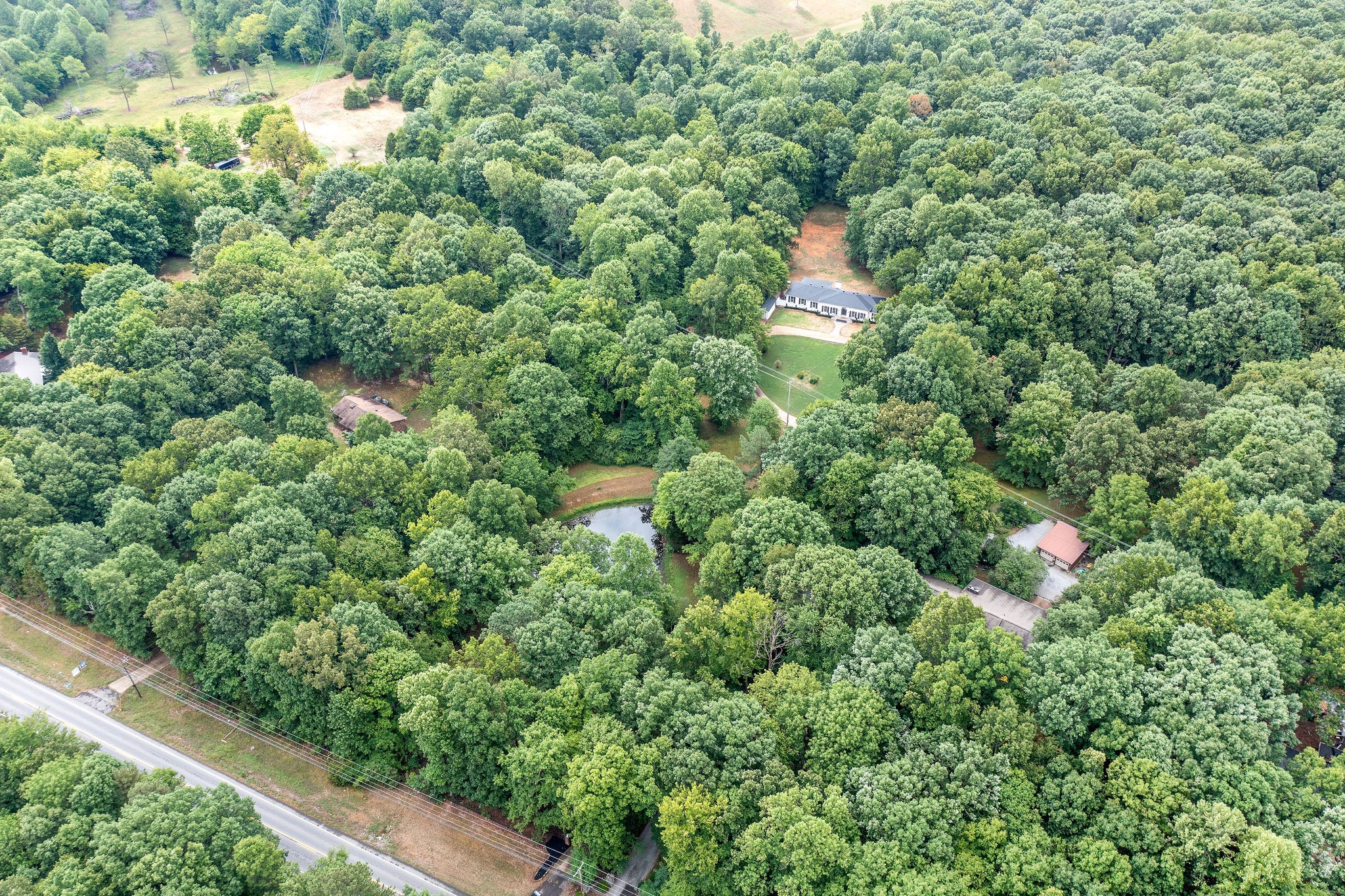 342 Highway 13 Cunningham, TN 37052 - Photo 40 of 44 an aerial view of residential house with outdoor space and trees all around