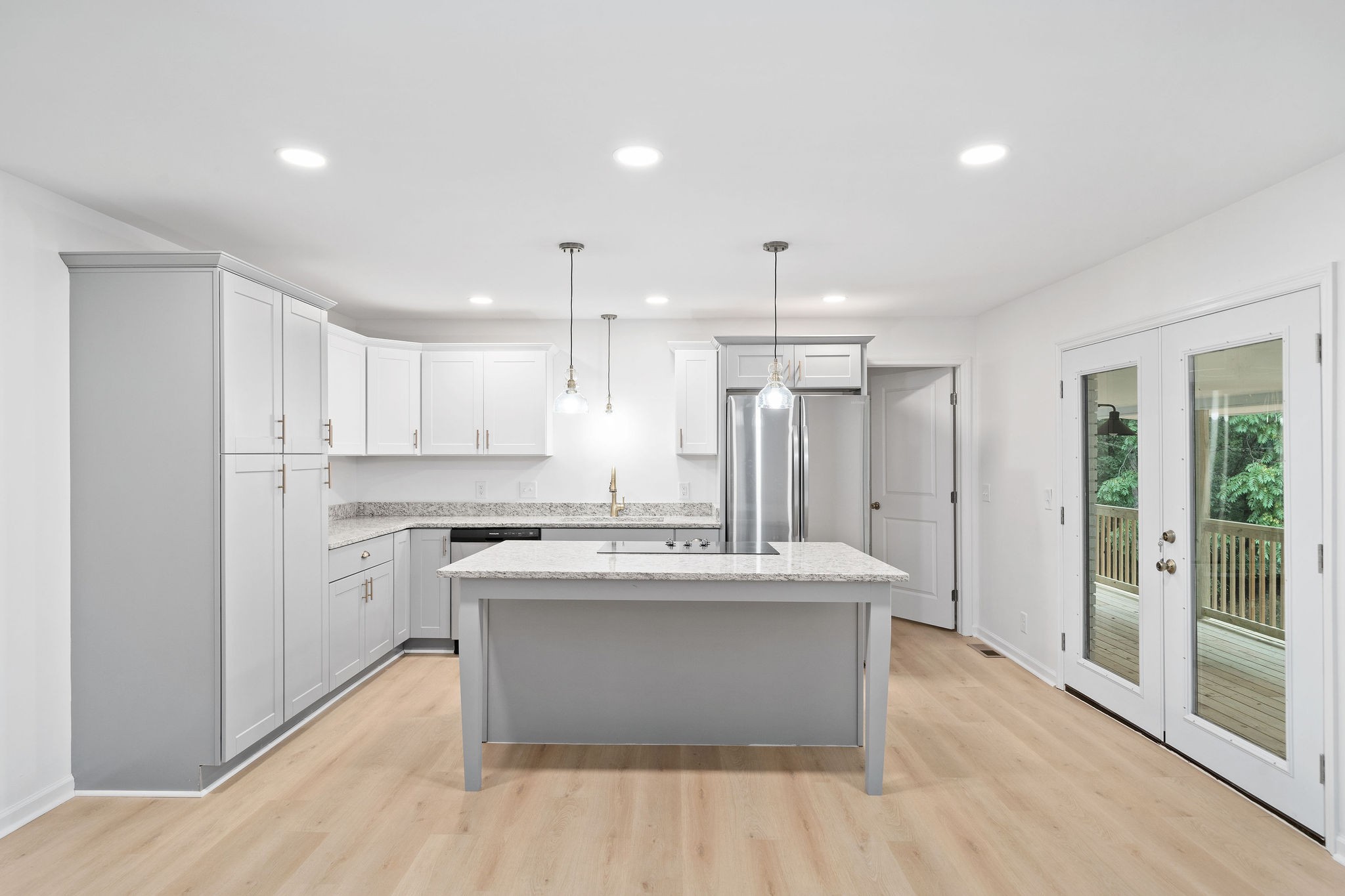 342 Highway 13 Cunningham, TN 37052 - Photo 6 of 44 a kitchen with kitchen island a sink stainless steel appliances and cabinets
