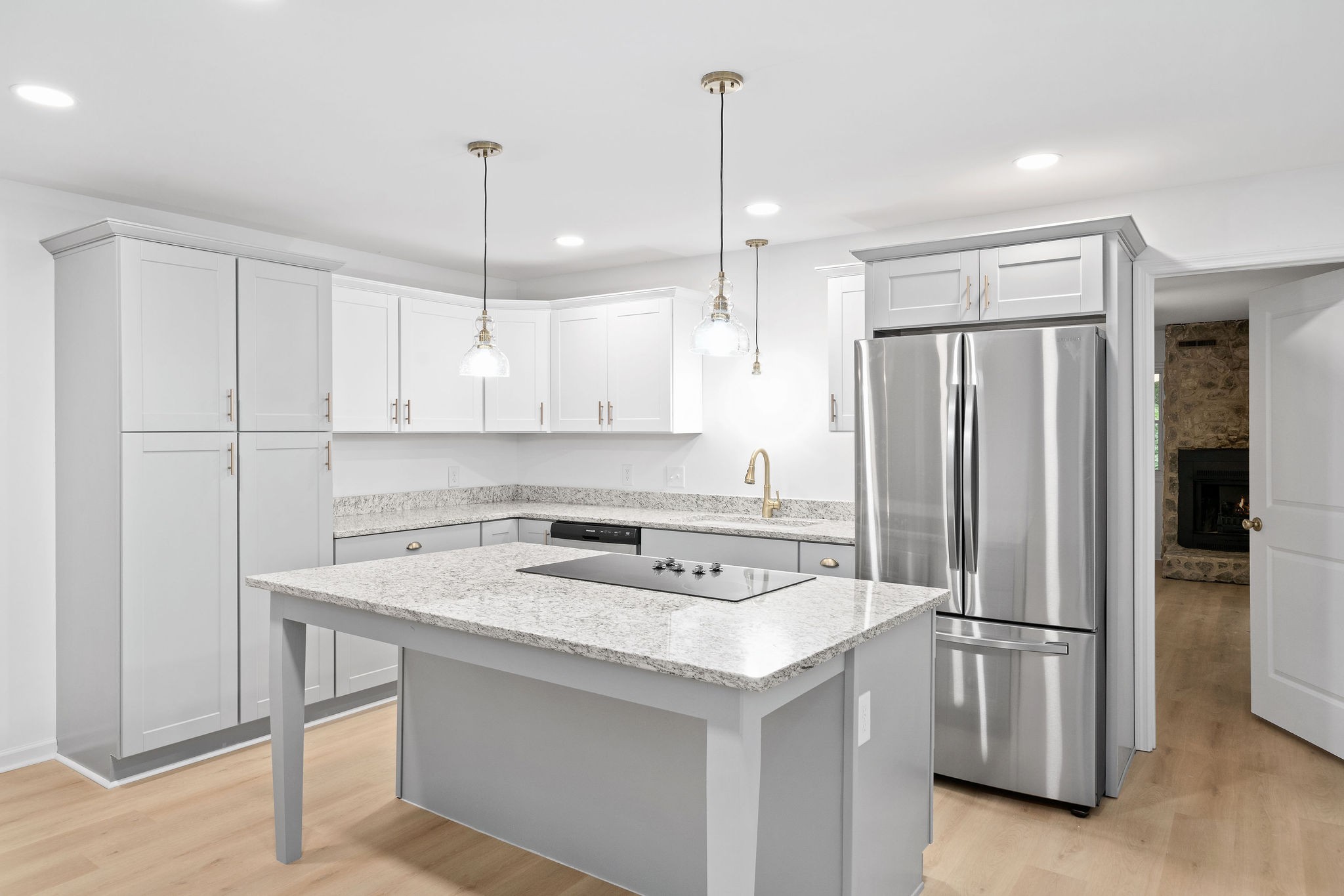 342 Highway 13 Cunningham, TN 37052 - Photo 8 of 44 a kitchen with stainless steel appliances granite countertop a refrigerator a sink a stove and white cabinets