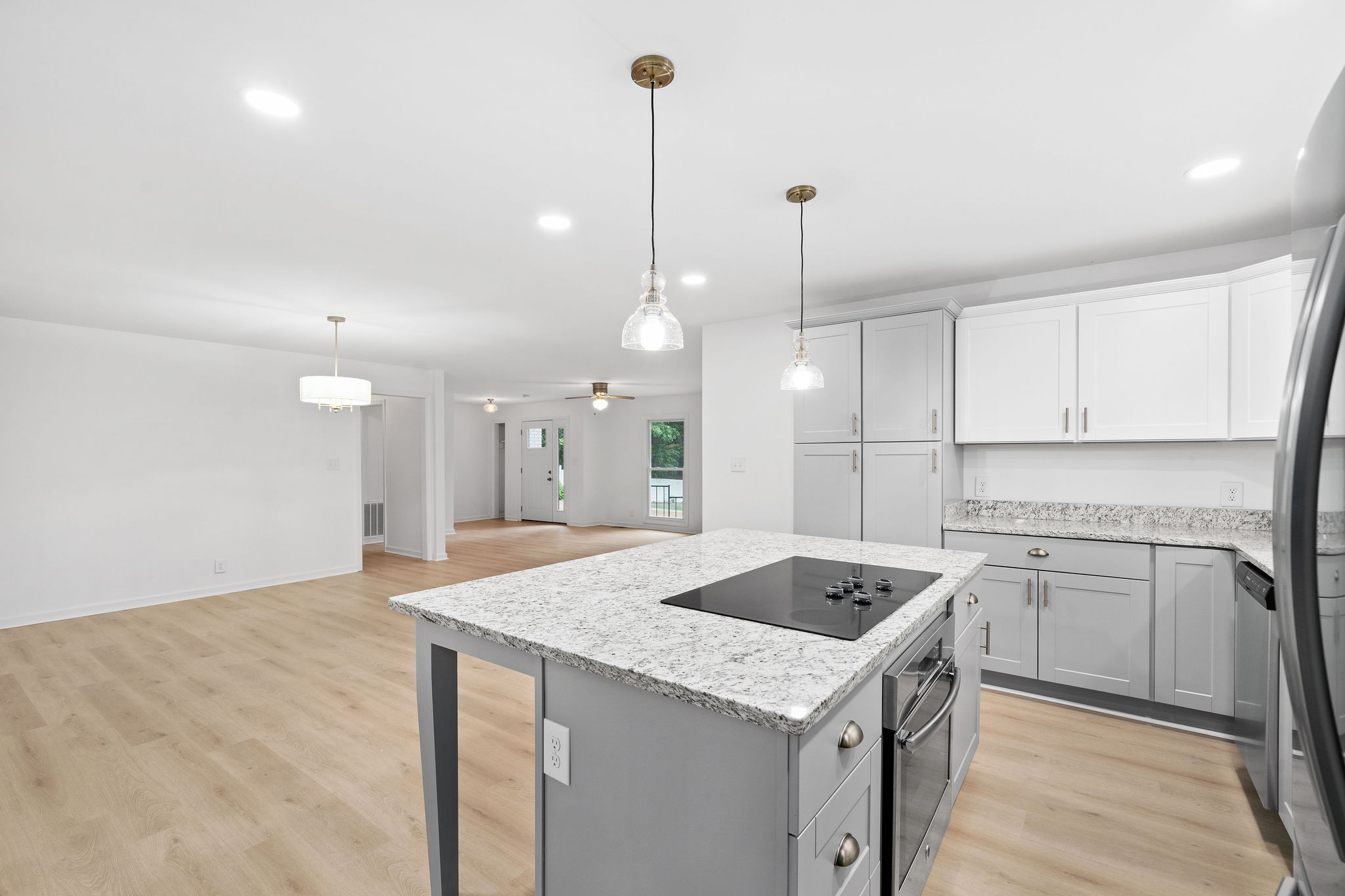 342 Highway 13 Cunningham, TN 37052 - Photo 9 of 44 a kitchen that has a sink a stove and a table with chairs