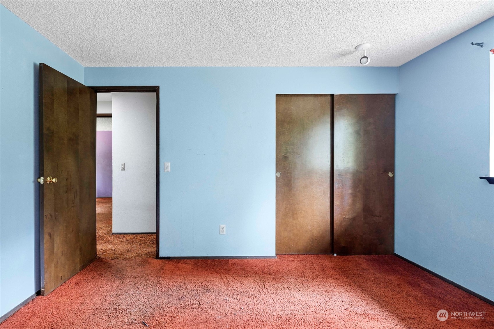 3156 Locker Road Southeast Port Orchard, WA 98366 - Photo 16 of 35 an empty room with closet and wooden floor