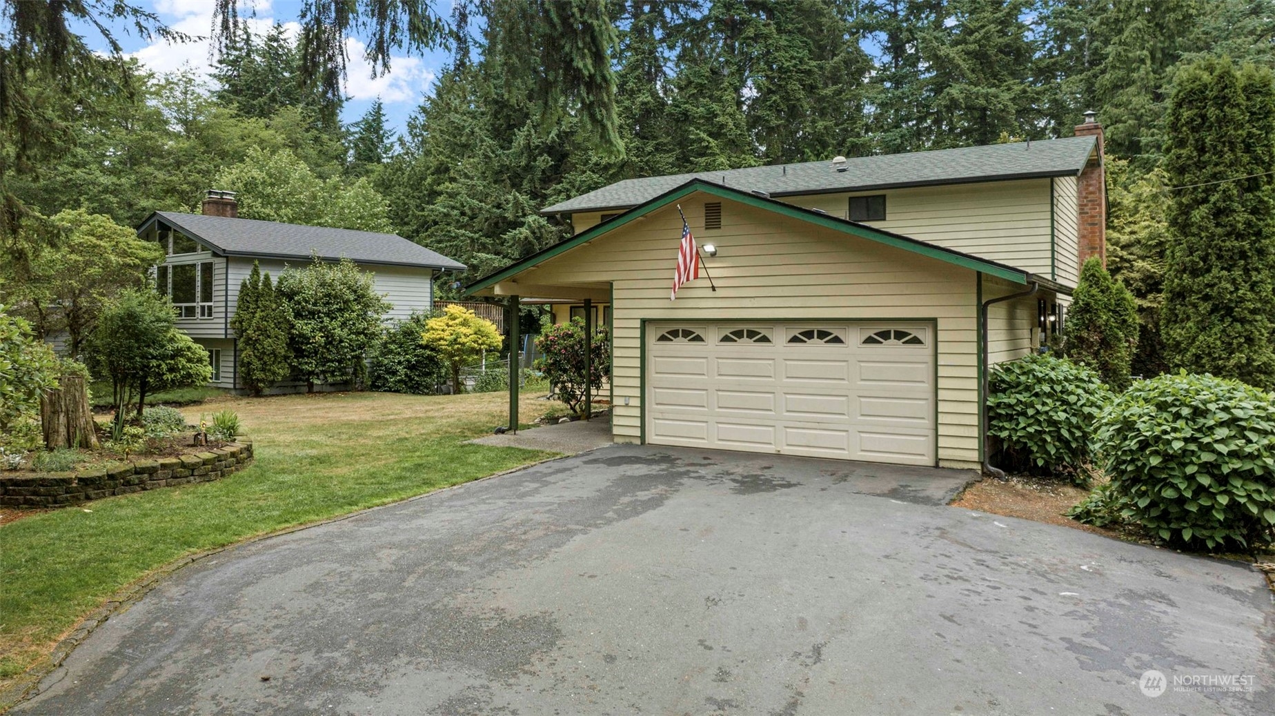 3156 Locker Road Southeast Port Orchard, WA 98366 - Photo 22 of 35 a view of a house with a yard and garage