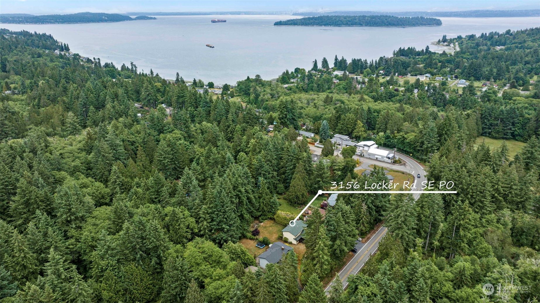 3156 Locker Road Southeast Port Orchard, WA 98366 - Photo 32 of 35 an aerial view of residential houses with outdoor space and trees