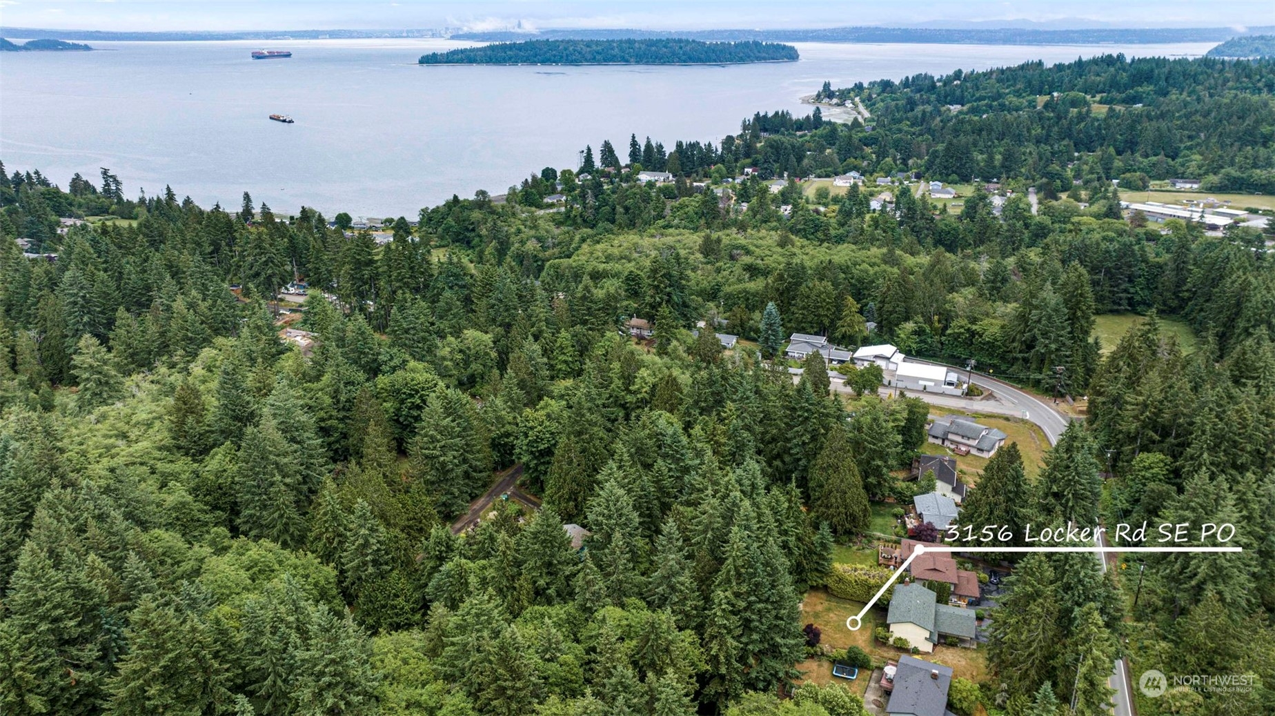3156 Locker Road Southeast Port Orchard, WA 98366 - Photo 33 of 35 an aerial view of a house with a yard and lake view