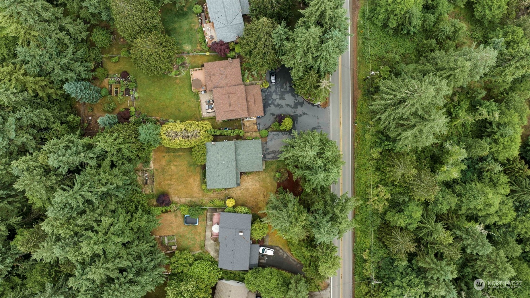 3156 Locker Road Southeast Port Orchard, WA 98366 - Photo 34 of 35 an aerial view of a house with a yard and trees