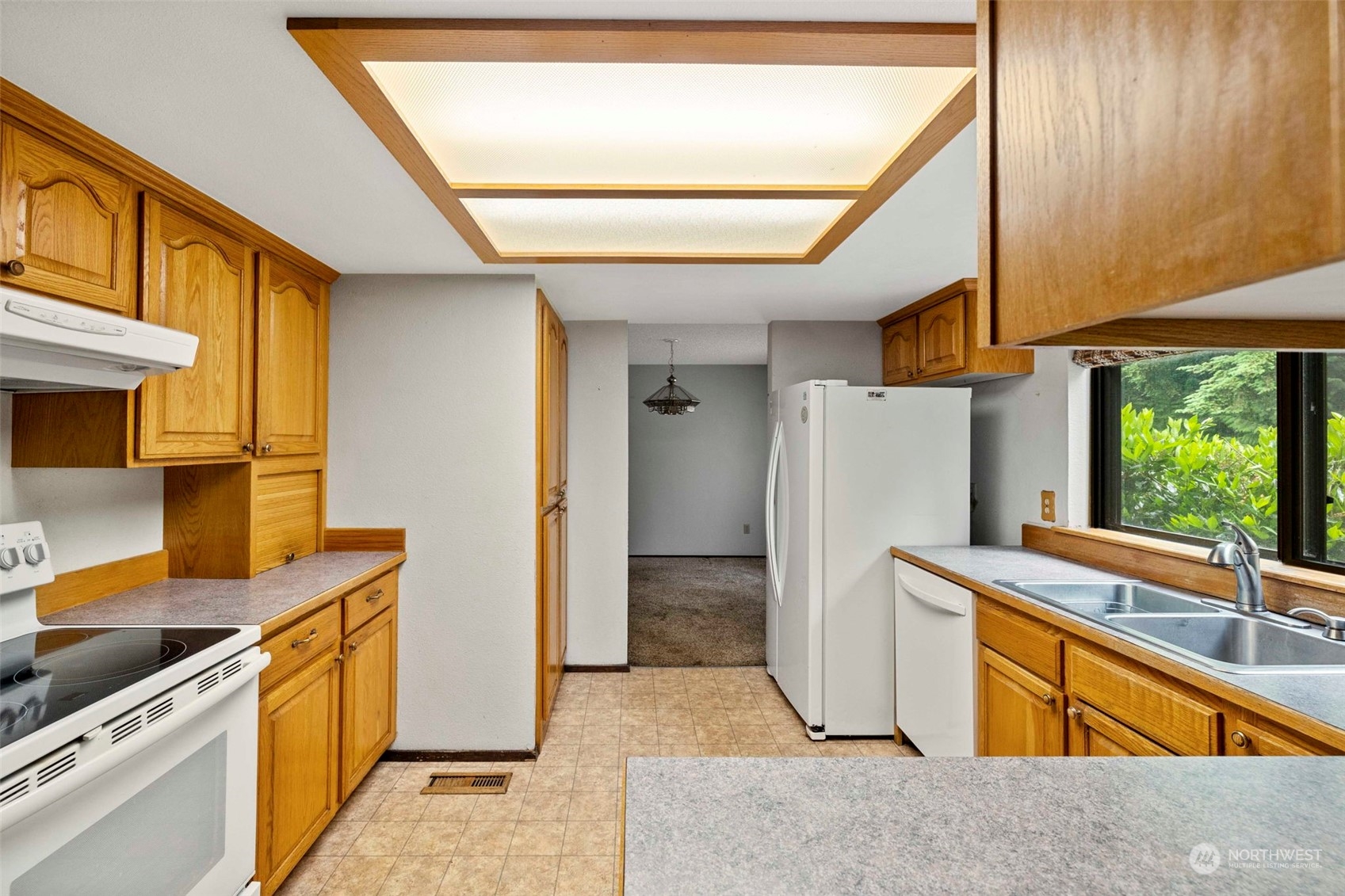 3156 Locker Road Southeast Port Orchard, WA 98366 - Photo 6 of 35 a kitchen with stainless steel appliances granite countertop a refrigerator and a sink