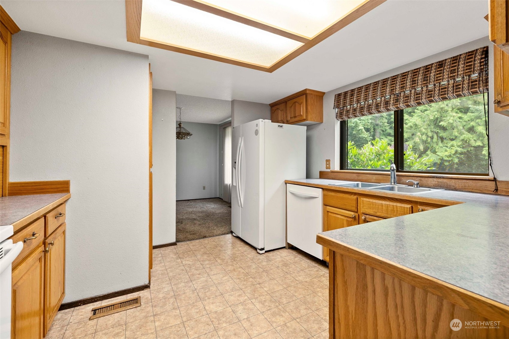 3156 Locker Road Southeast Port Orchard, WA 98366 - Photo 7 of 35 a view of kitchen with furniture and refrigerator
