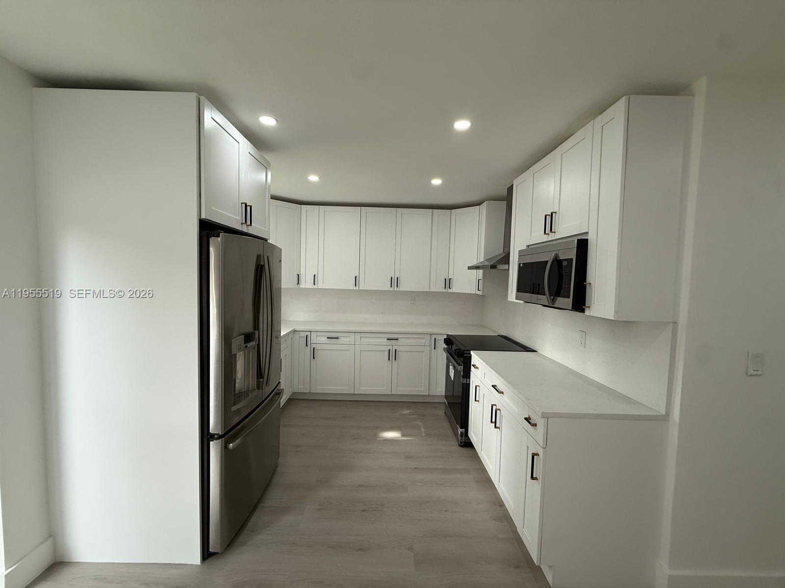 4366 Southwest 5th Terrace Miami, FL 33134 - Photo 14 of 30 a kitchen with stainless steel appliances a refrigerator sink and microwave