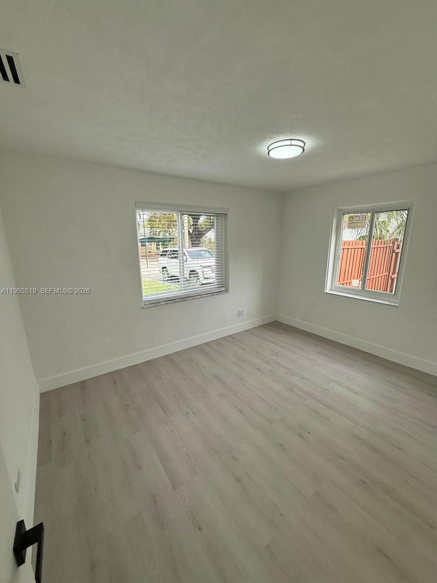 4366 Southwest 5th Terrace Miami, FL 33134 - Photo 18 of 30 an empty room with windows