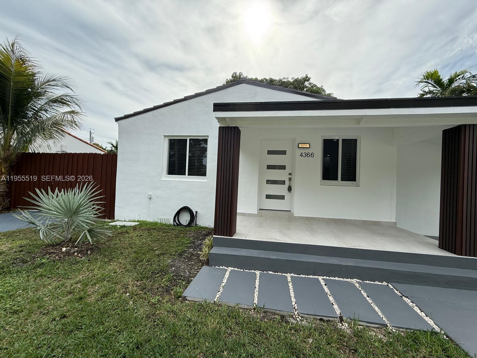 4366 Southwest 5th Terrace Miami, FL 33134 - Photo 2 of 30 a front view of a house with a yard