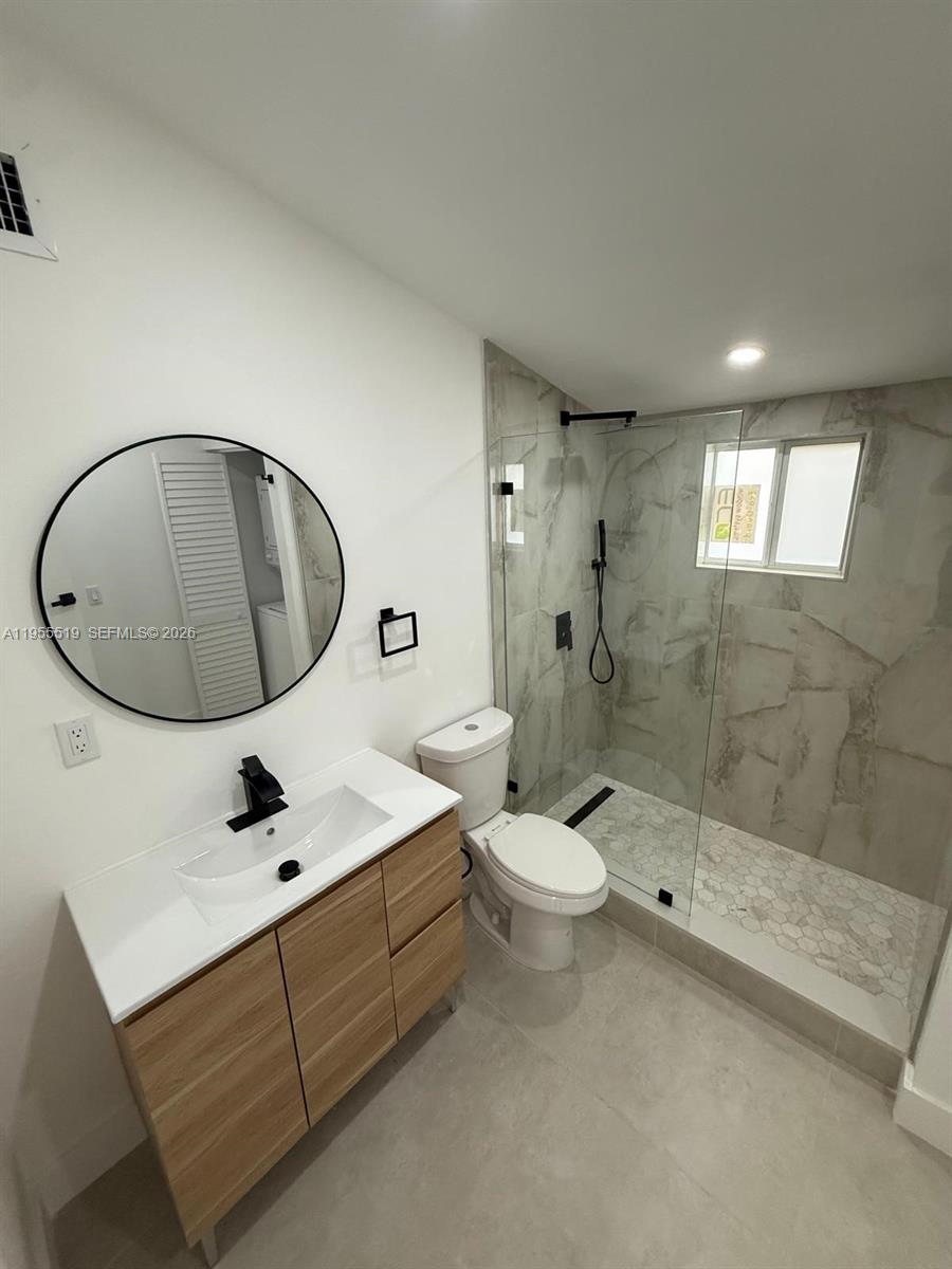 4366 Southwest 5th Terrace Miami, FL 33134 - Photo 24 of 30 a bathroom with a sink a toilet and shower