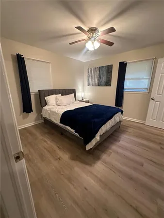 a bedroom with a bed and a mirror