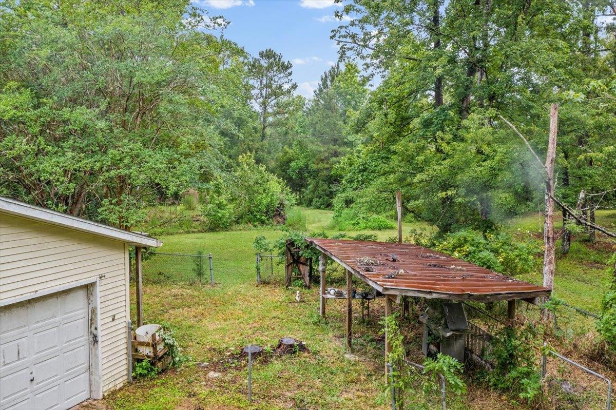 3093-1 Lannie Road Jacksonville, FL 32218 - Photo 11 of 16 a backyard of a house with table and chairs