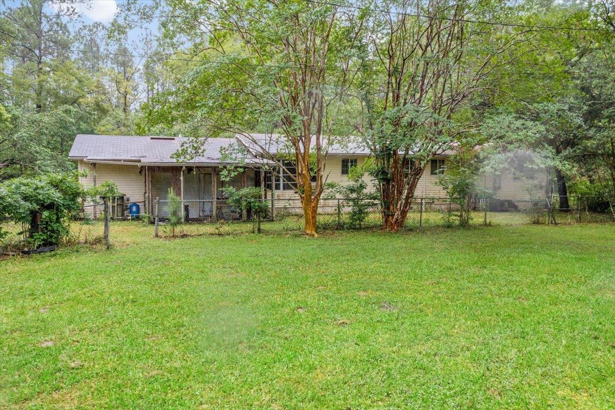 3093-1 Lannie Road Jacksonville, FL 32218 - Photo 12 of 16 a view of a house with a big yard and large trees
