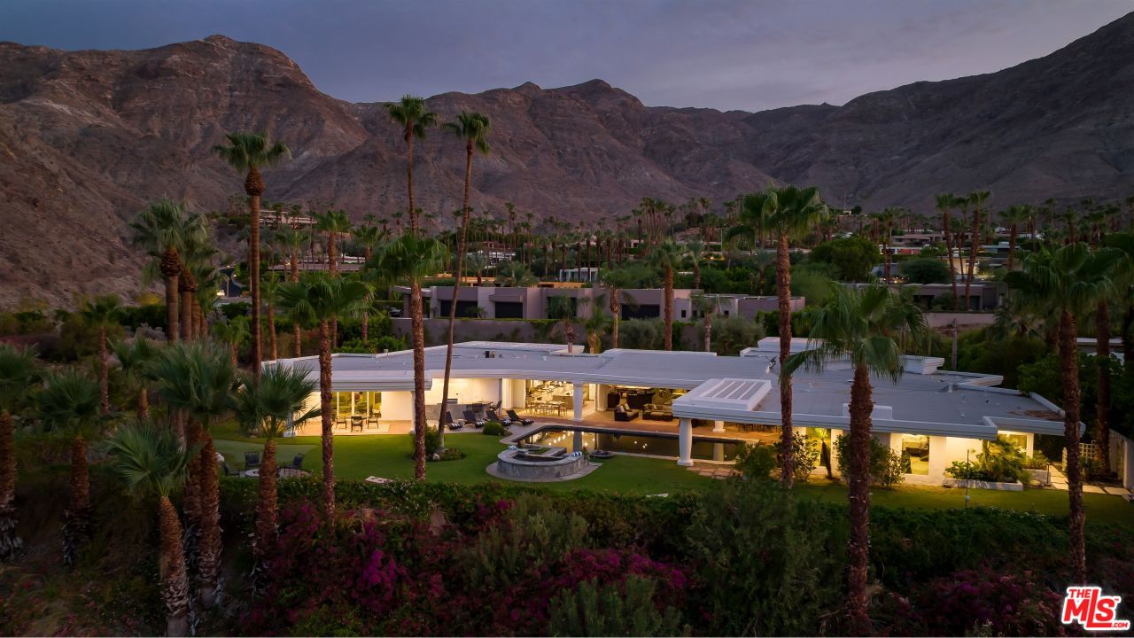 70375 Calico Road Rancho Mirage, CA 92270 - Photo 1 of 46 a view of a swimming pool with a garden