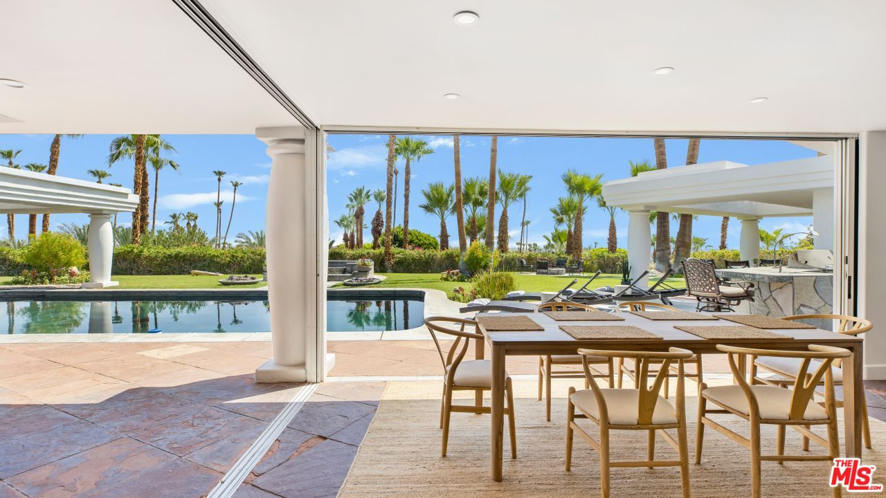 70375 Calico Road Rancho Mirage, CA 92270 - Photo 12 of 46 a view of a patio with a table and chairs