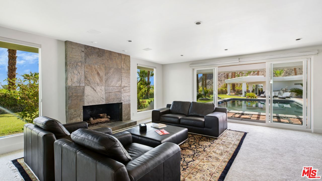 70375 Calico Road Rancho Mirage, CA 92270 - Photo 16 of 46 a living room with furniture and a fireplace
