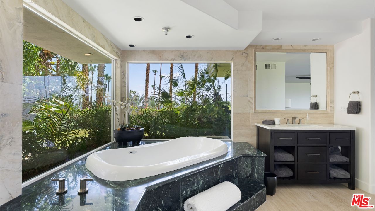 70375 Calico Road Rancho Mirage, CA 92270 - Photo 17 of 46 a bathroom with a sink a toilet and tub