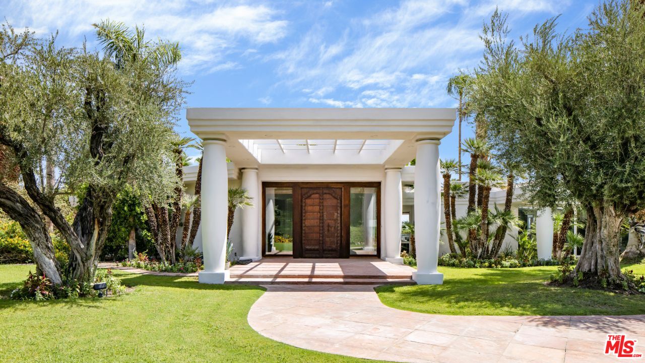 70375 Calico Road Rancho Mirage, CA 92270 - Photo 3 of 46 a view of a building with a garden
