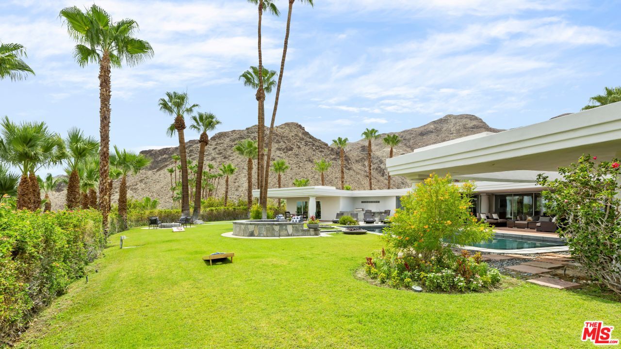 70375 Calico Road Rancho Mirage, CA 92270 - Photo 34 of 46 a front view of a house with garden