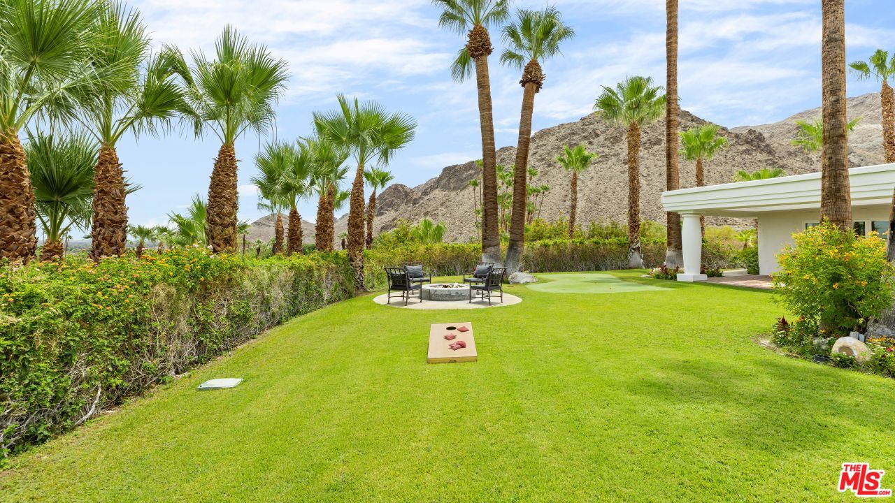 70375 Calico Road Rancho Mirage, CA 92270 - Photo 35 of 46 a view of swimming pool with a table and chairs