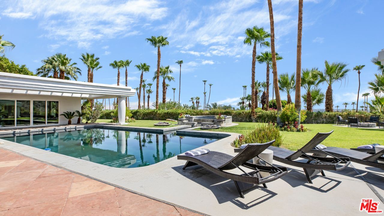 70375 Calico Road Rancho Mirage, CA 92270 - Photo 38 of 46 a view of swimming pool with chairs and table in patio