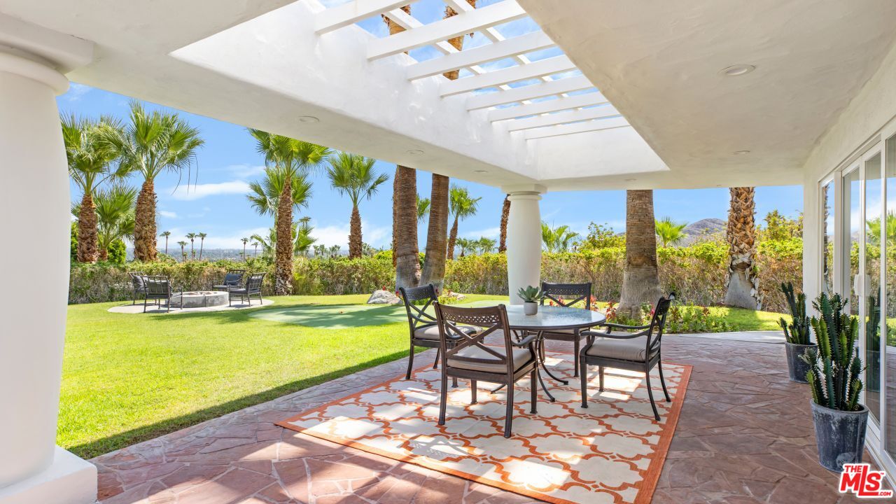 70375 Calico Road Rancho Mirage, CA 92270 - Photo 40 of 46 a building outdoor space with patio furniture and garden view