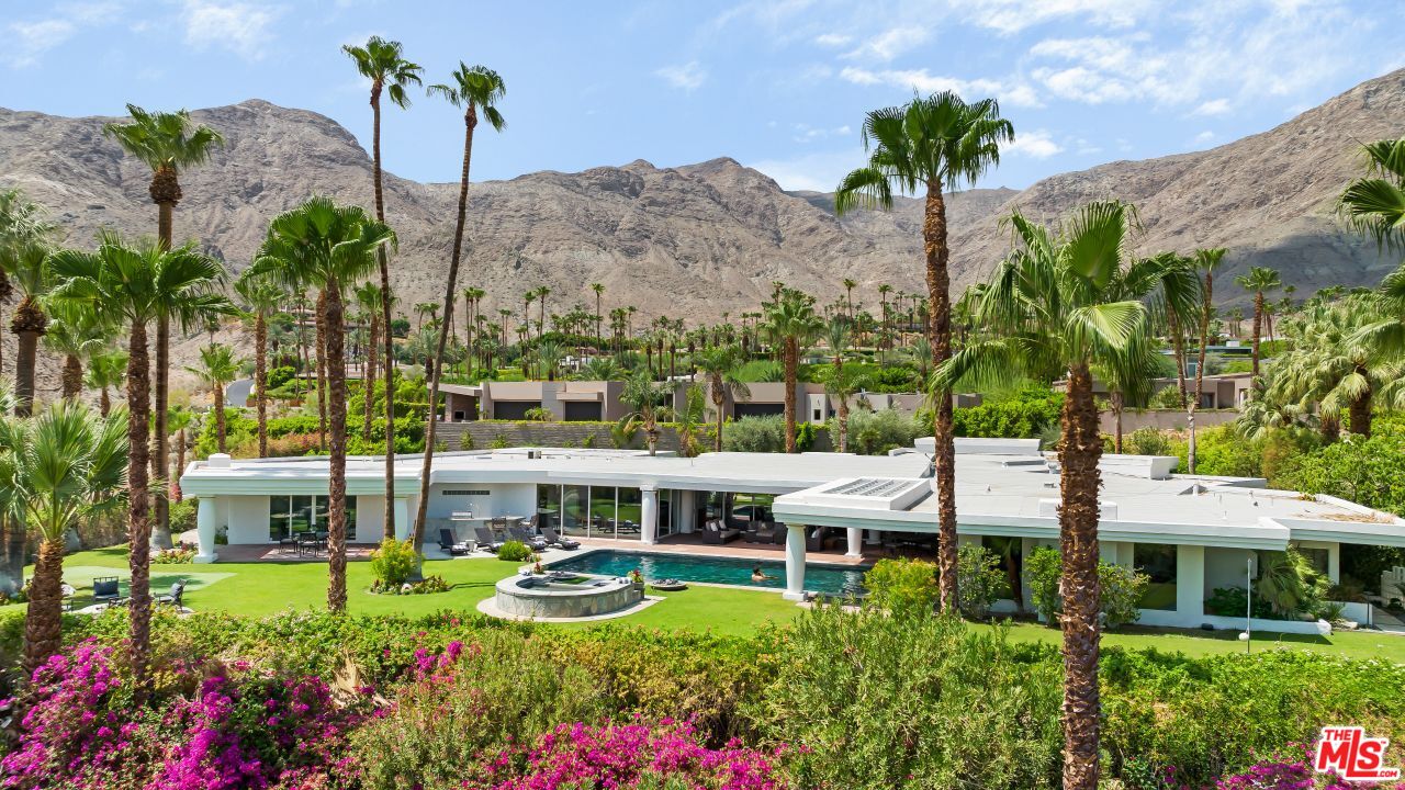 70375 Calico Road Rancho Mirage, CA 92270 - Photo 44 of 46 a view of a house with a garden and a yard