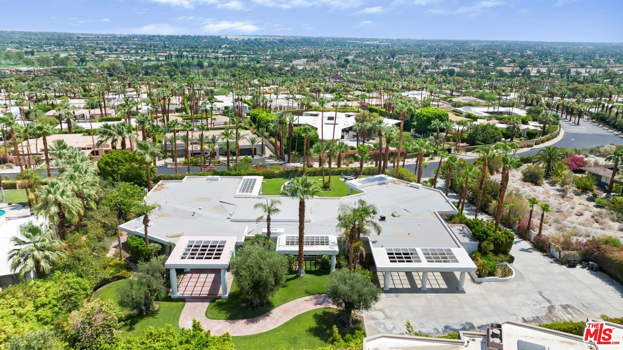 70375 Calico Road Rancho Mirage, CA 92270 - Photo 45 of 46 an aerial view of residential houses with outdoor space and trees