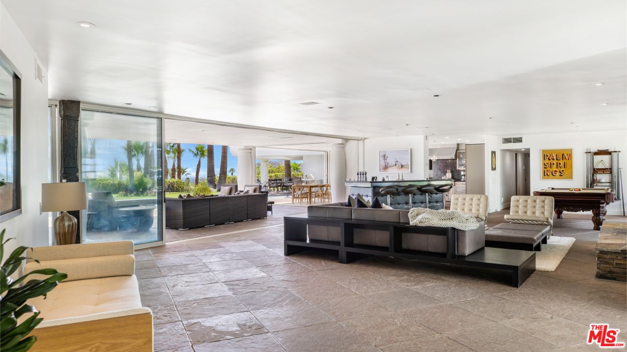 70375 Calico Road Rancho Mirage, CA 92270 - Photo 5 of 46 a living room with furniture and a large window