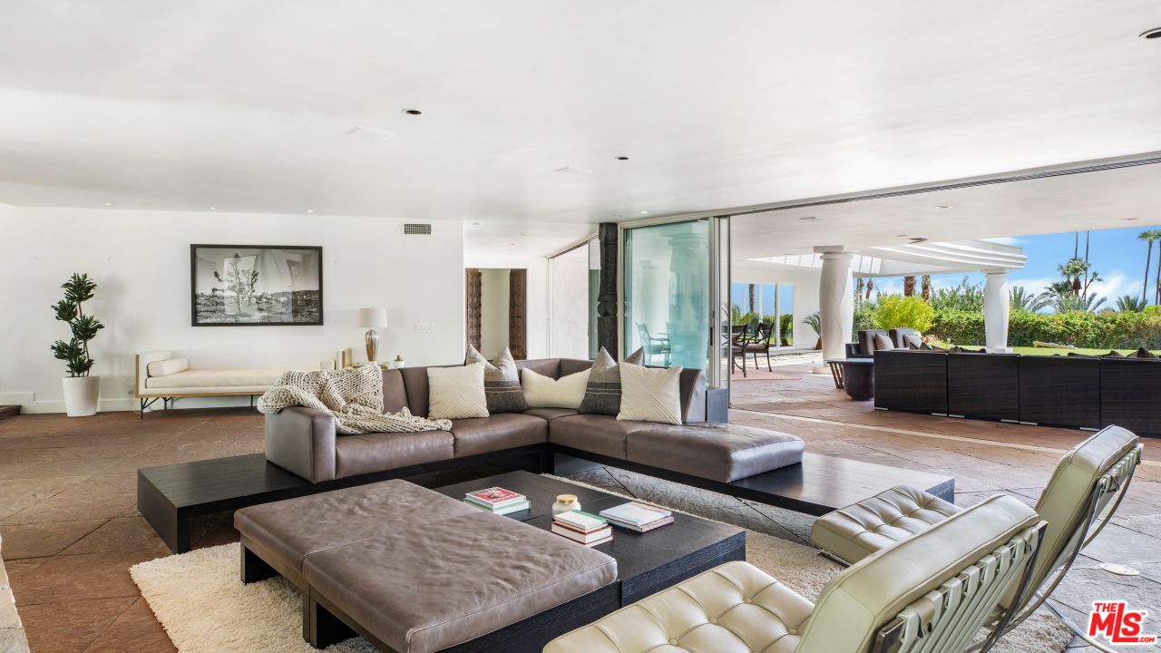 70375 Calico Road Rancho Mirage, CA 92270 - Photo 6 of 46 a living room with furniture rug and a large window