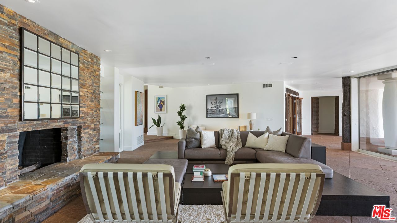 70375 Calico Road Rancho Mirage, CA 92270 - Photo 7 of 46 a living room with two beds and a fireplace
